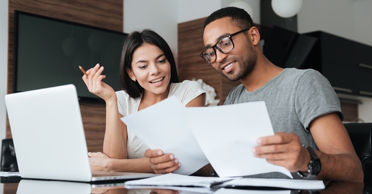 couple reviewing papers